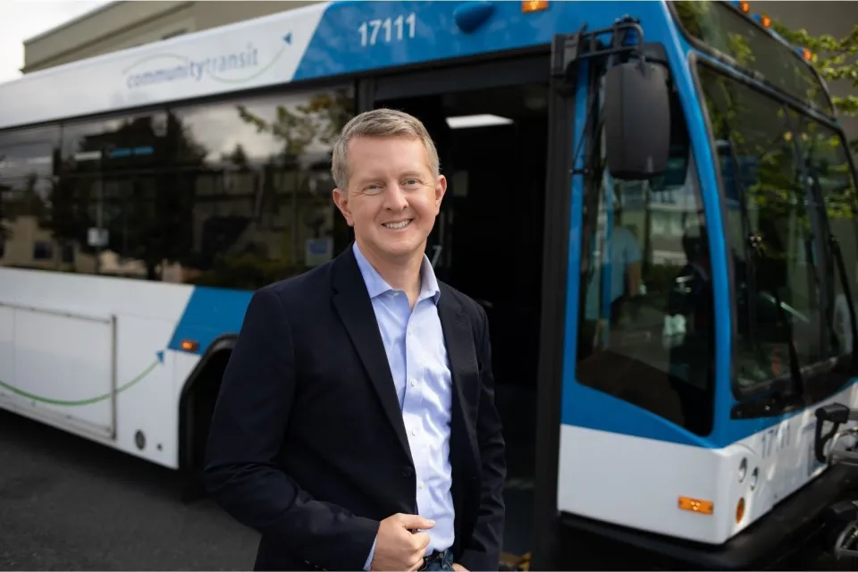 Ken Jennings stands in front of Snohomish County Community Transit bus.